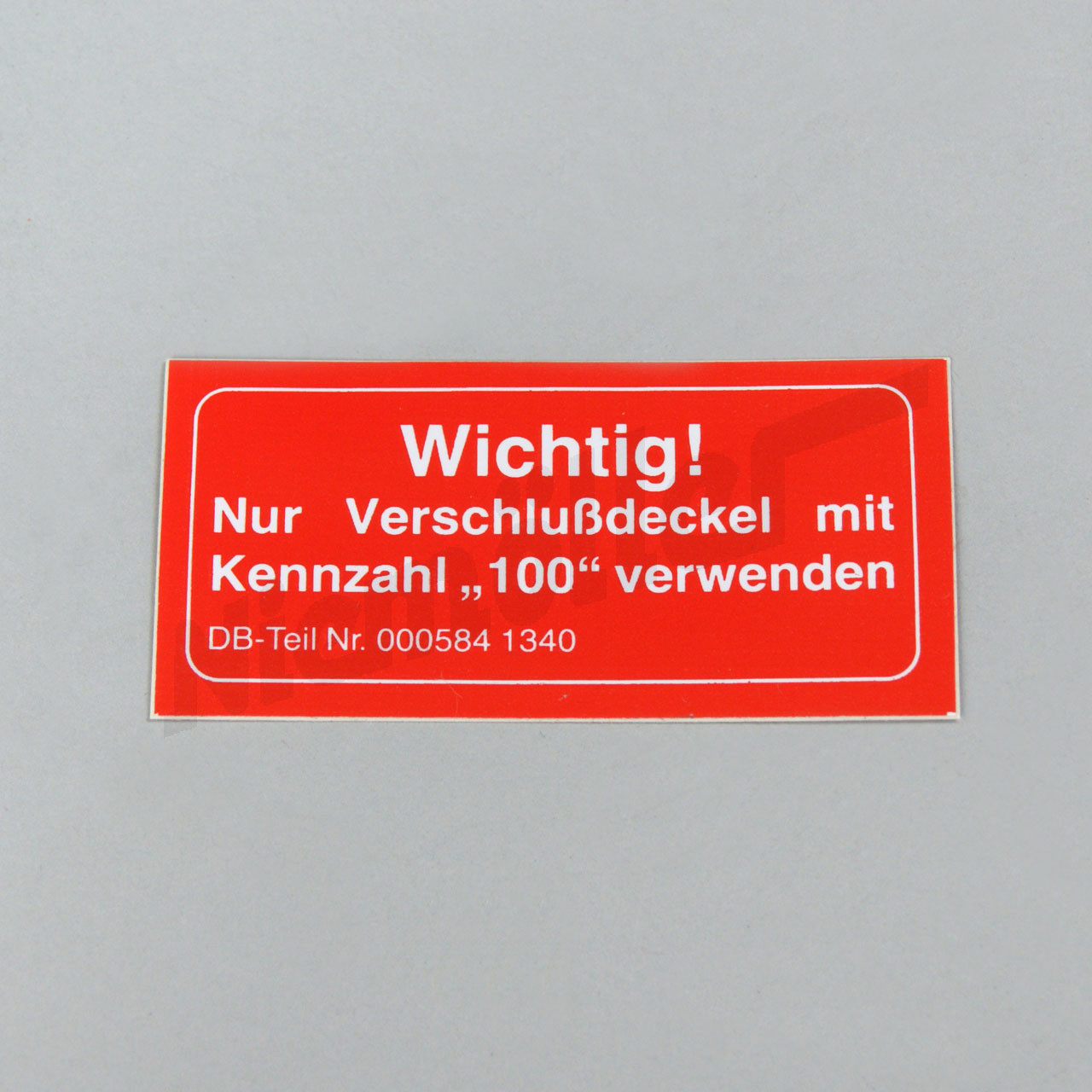 G 58 020 - Instruction plate, radiator, in German "nur Verschlussdeckel mit Kennzahl 100".
