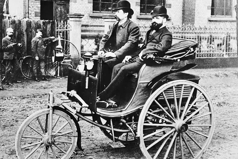     Carl Benz - historical photo around 1890 in Mannheim, at the wheel of a further developed version of his patented motor car, based on the original model no. 1.
