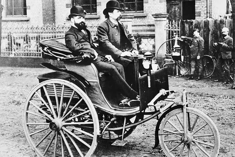     Carl Benz - driving through Mannheim in 1890, at the wheel of his patent motor car in the form of a further development of the original model number 1
